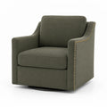 Fauteuil pivotant en tissu vert avec clous décoratifs